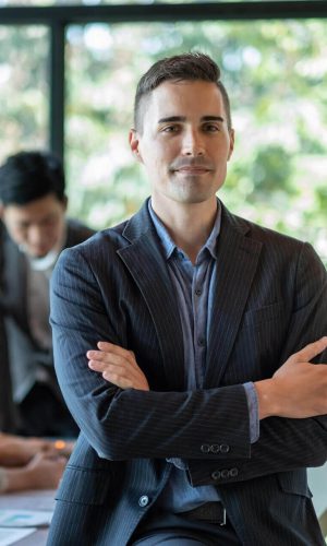 portrait-of-a-smiling-handsome-businessman-with-cr-2025-01-10-05-29-27-utc-e1755849701972-1.jpg